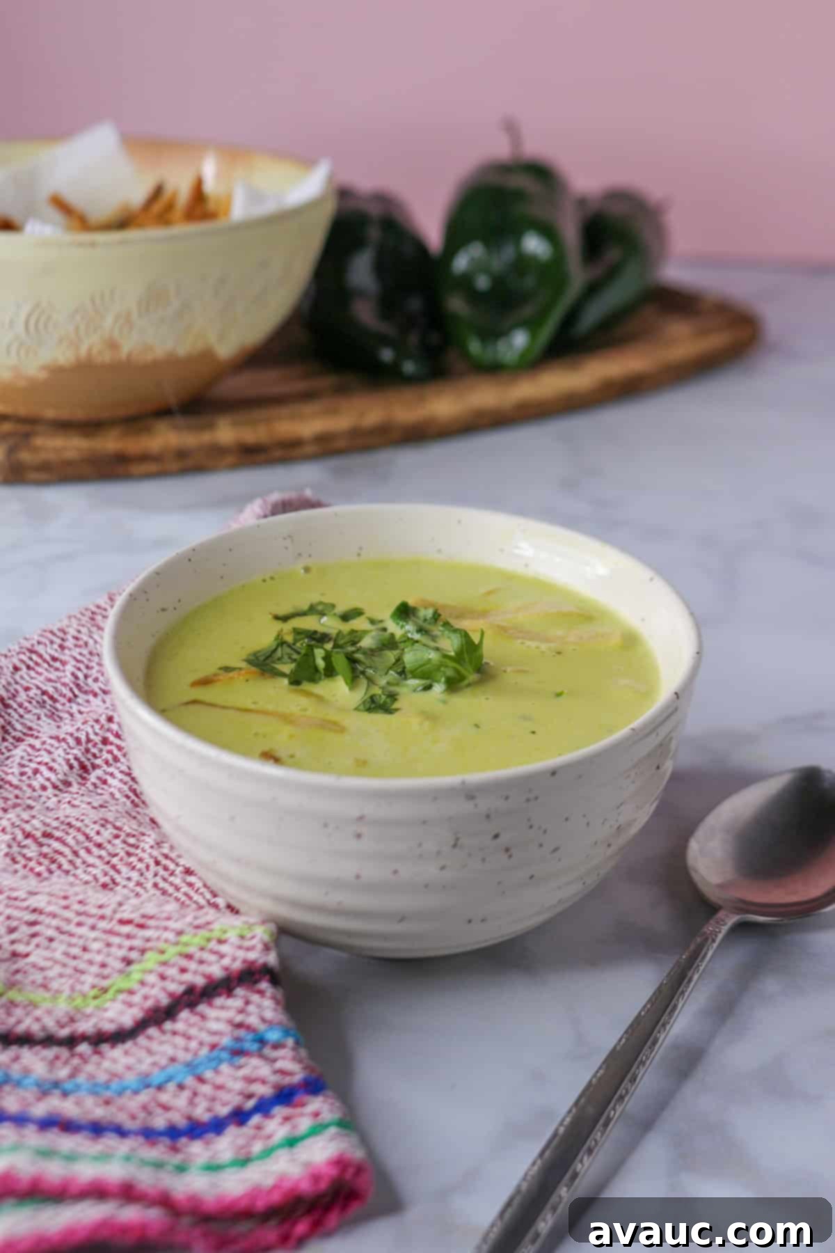 Hearty Poblano Soup: Dairy-Free Creaminess 2 Poblano cream soup in a bowl garnished with tortilla strips and cilantro