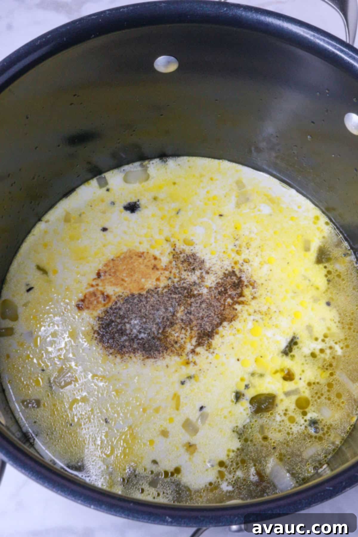Hearty Poblano Soup: Dairy-Free Creaminess 8 Broth, cream, and spices added to the sautéed vegetables in a pot