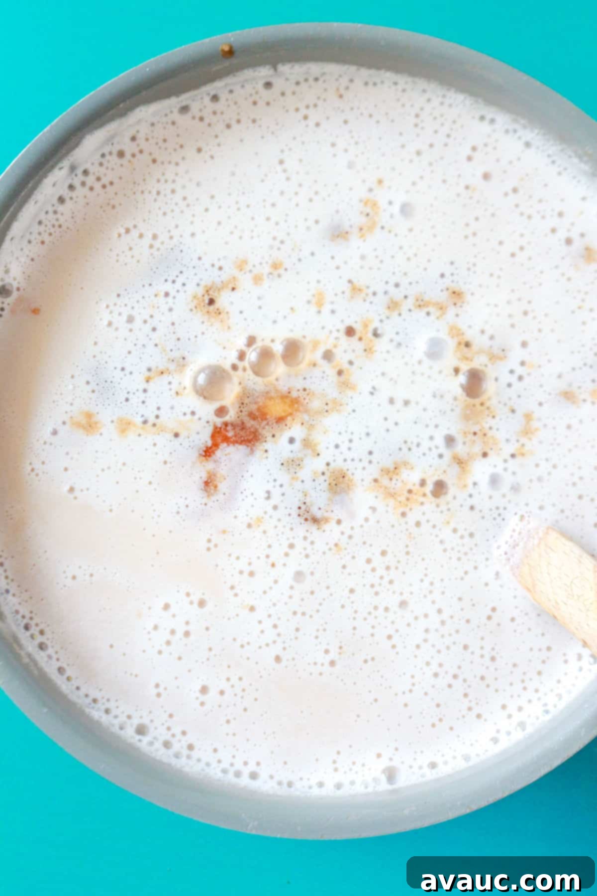Creamy Rice Atole Dairy-Free Friendly 9 A small pot with vanilla extract in the atole