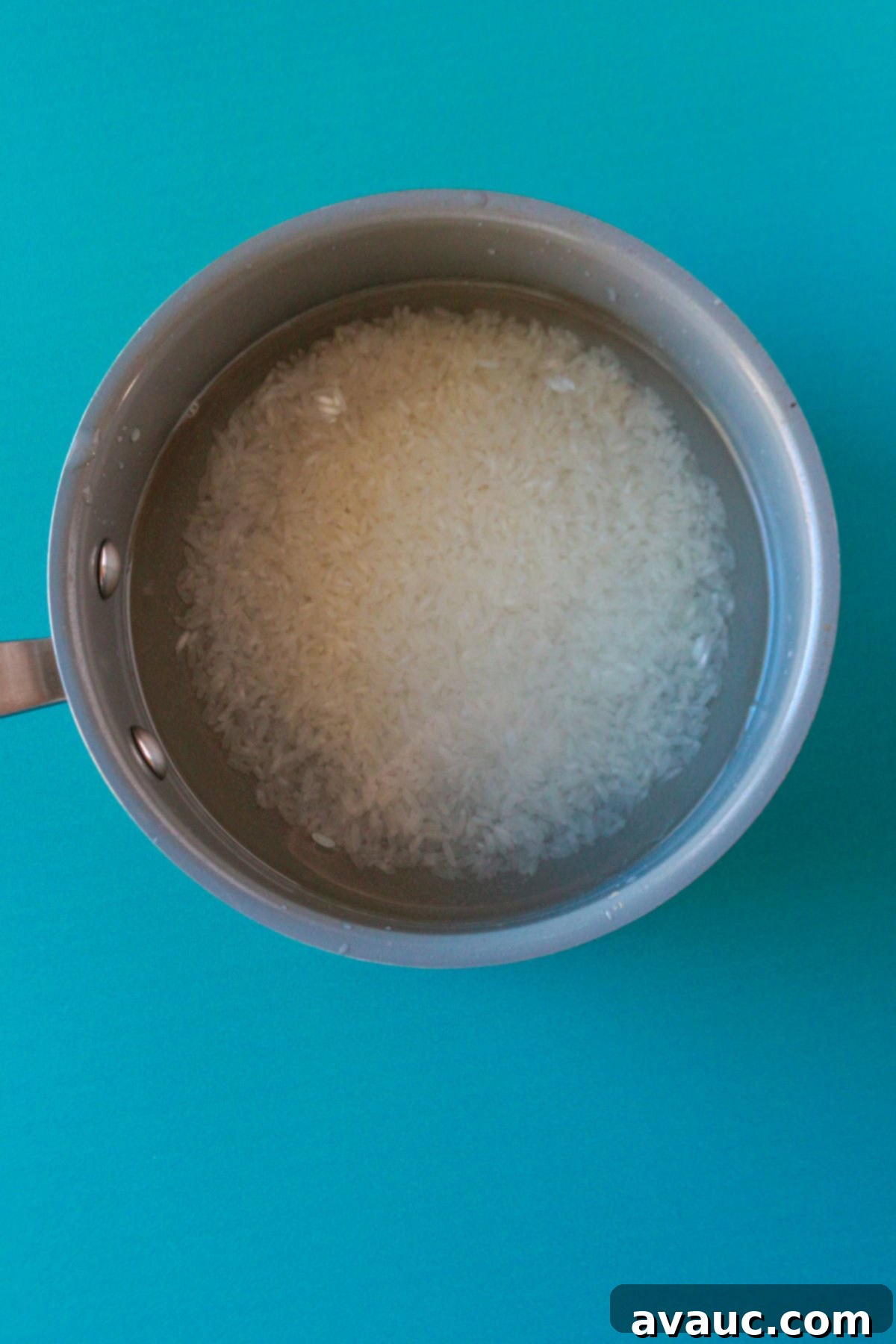 Creamy Rice Atole Dairy-Free Friendly 5 A small pot with water and rice