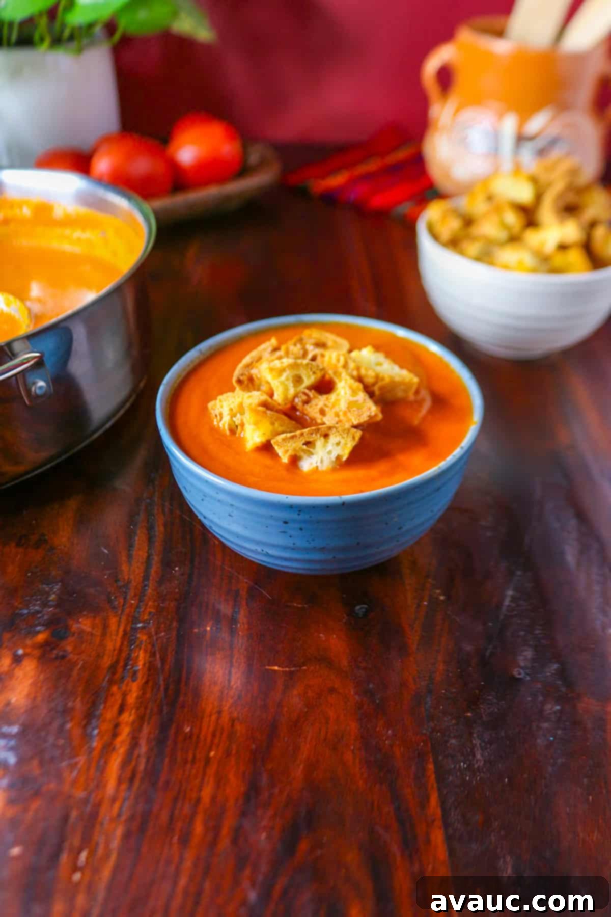 Spiced Chipotle Tomato Soup with Garlic Croutons 10 Chipotle tomato soup in a blue bowl and topped with croutons