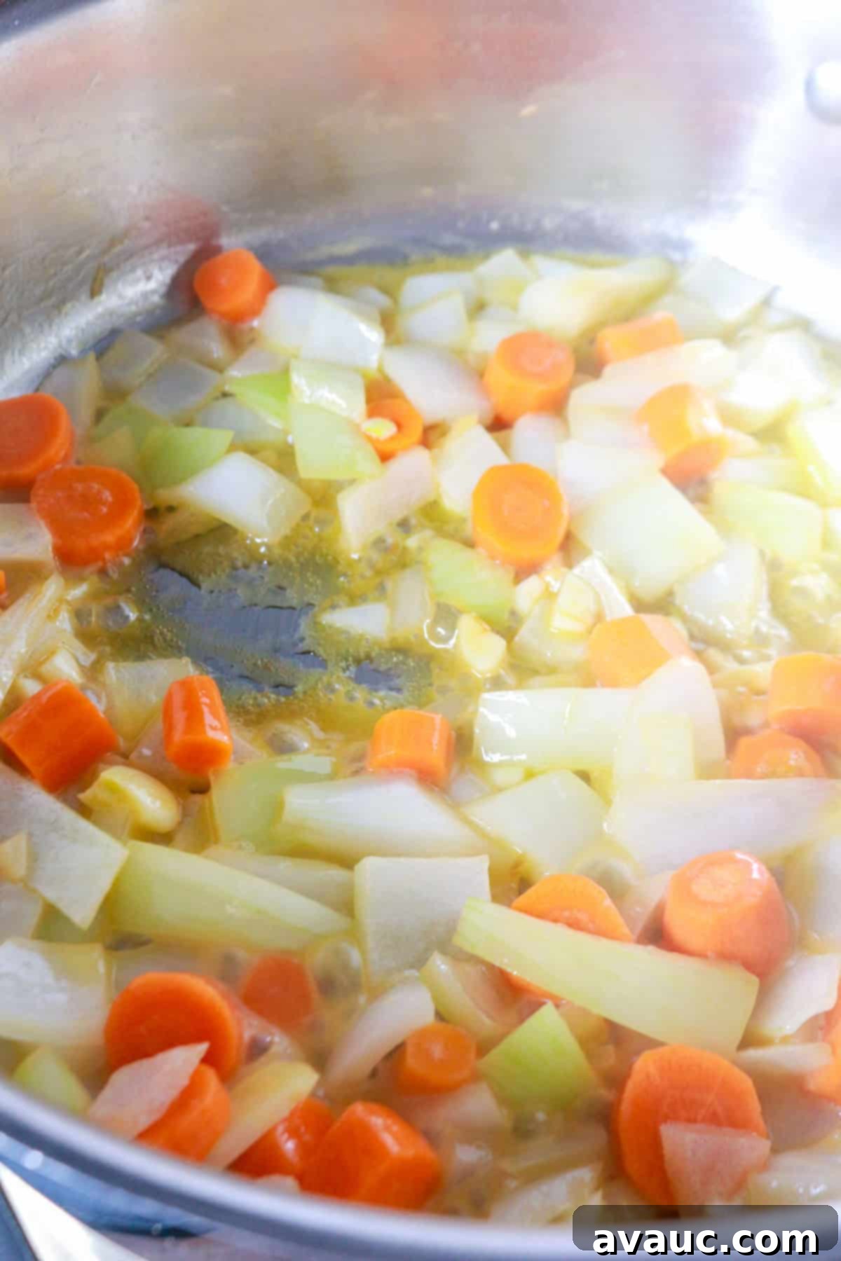 Spiced Chipotle Tomato Soup with Garlic Croutons 4 Sautéing chopped onions, carrots and garlic in a pot