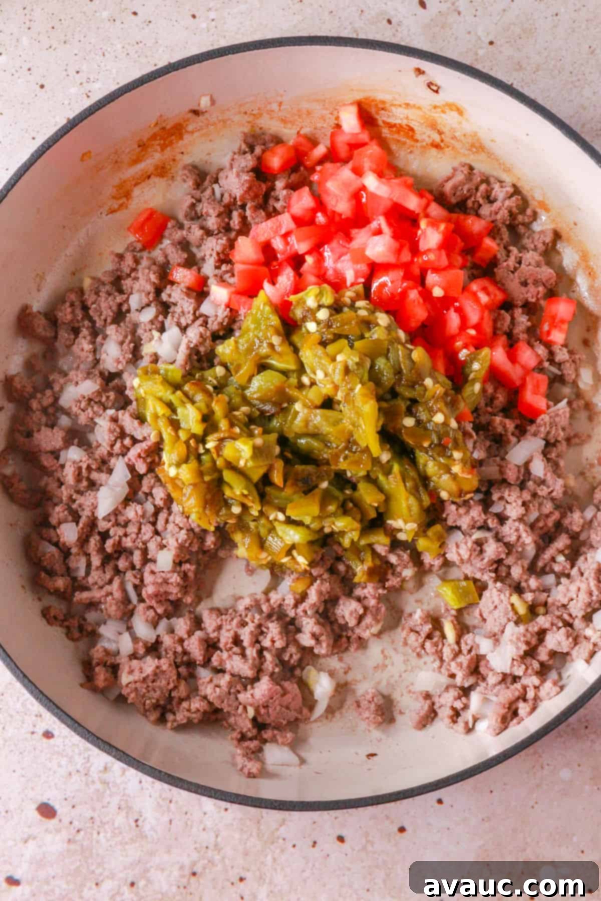 Ground beef with diced tomatoes and diced, roasted green chiles