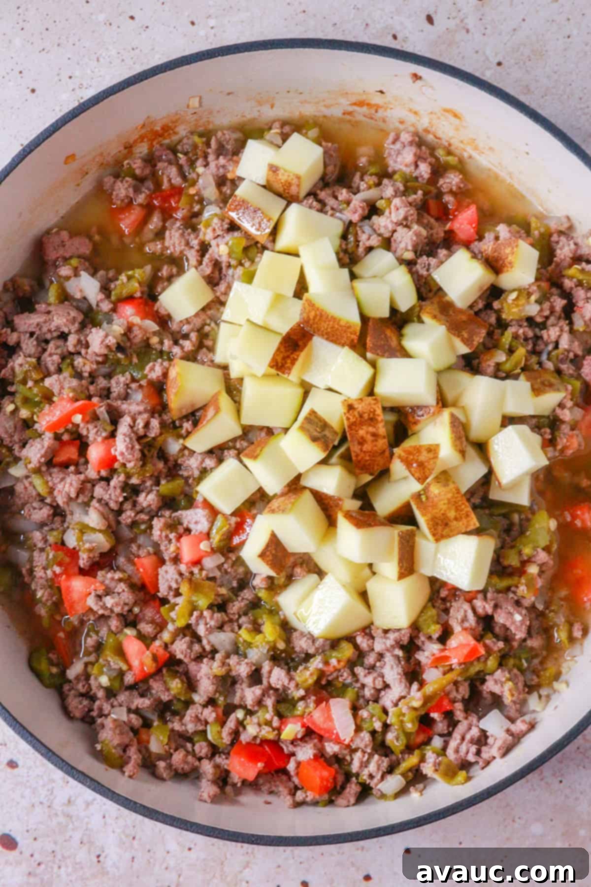 Making picadillo with potatoes
