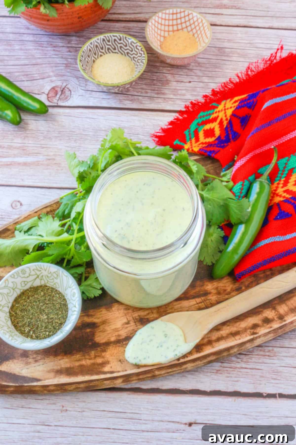 Vegan Creamy Serrano Ranch 9 A beautifully composed shot of a jar of homemade creamy serrano ranch dressing, ready to be enjoyed, emphasizing its appealing texture and color.