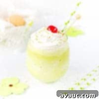Homemade Shamrock Shake topped with whipped cream and a cherry