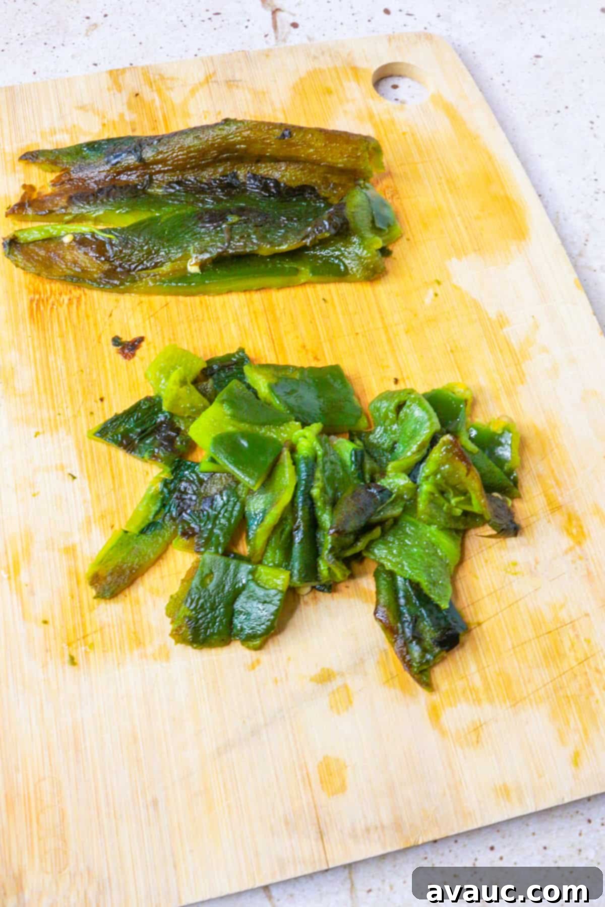 Chopped, roasted poblanos on a cutting board