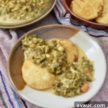 Crispy Golden Potato Patties Smothered in Creamy Chile con Queso