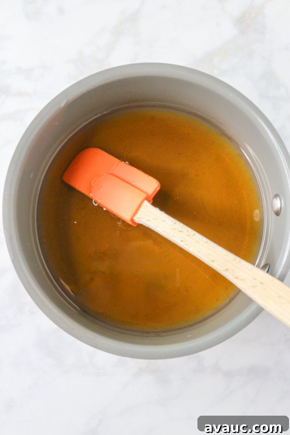 Pineapple Strawberry Oasis 4 Honey simple syrup in small saucepan