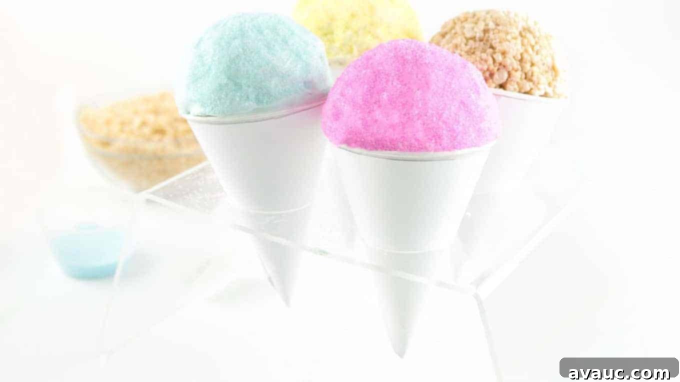 Assortment of vibrant Rice Krispies Snow Cones in an ice cream cone holder, topped with colored chocolate and sanding sugar.