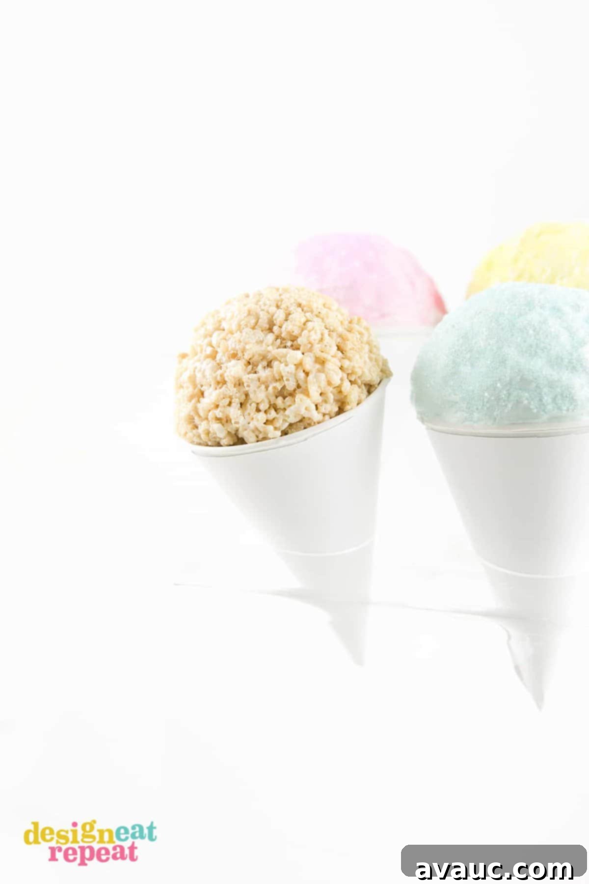 A shaped ball of Rice Krispies cereal placed inside a paper snow cone cup, ready for topping.