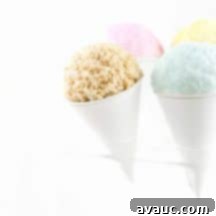 Simple Krispie Snow Cone Treats 8 Easy Rice Krispies Snow Cones with colorful candy coating and sprinkles.
