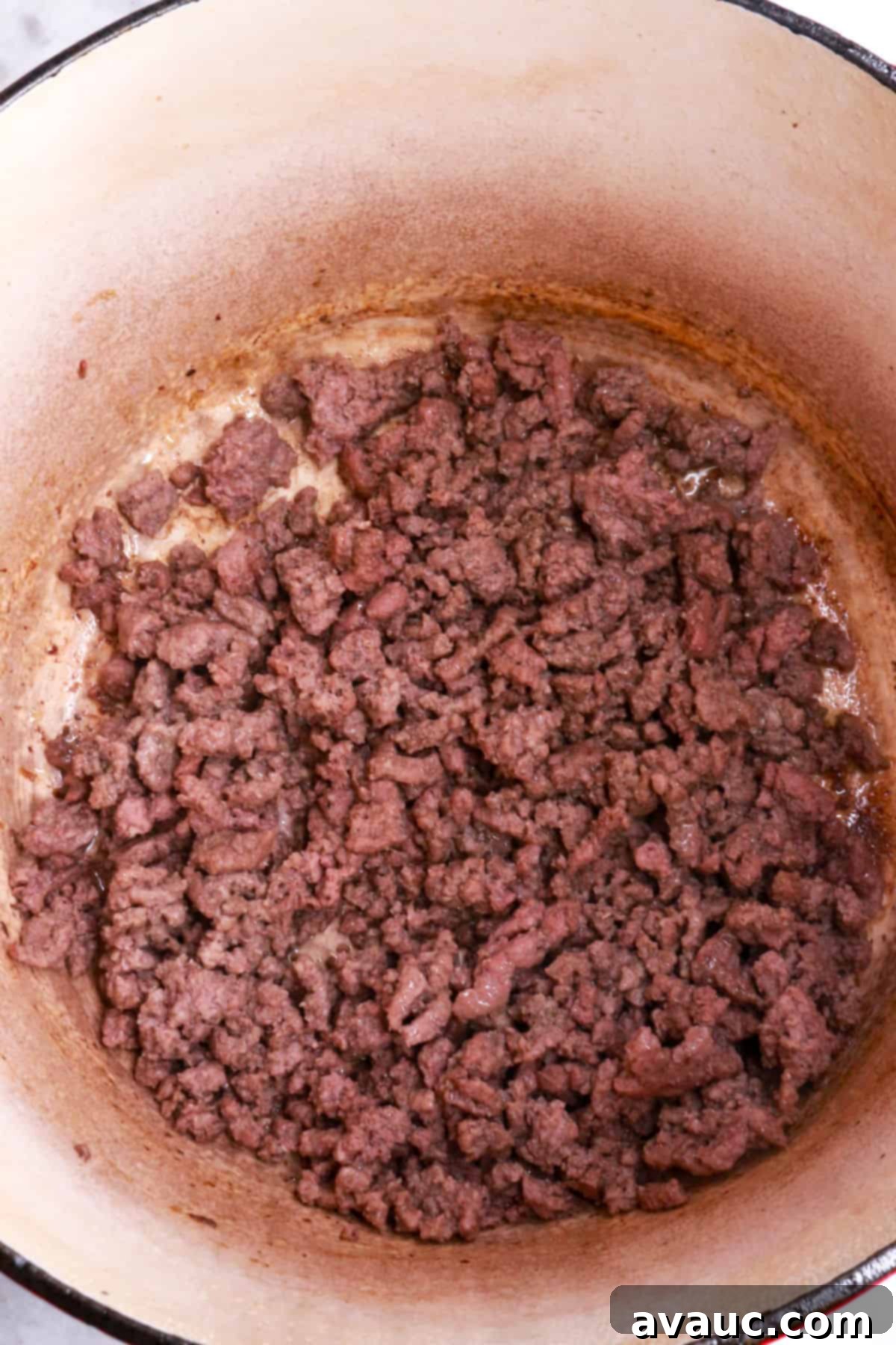 Jalapeño Ground Beef Stew 4 Browning ground beef in a Dutch oven, showing the meat changing color as it cooks.