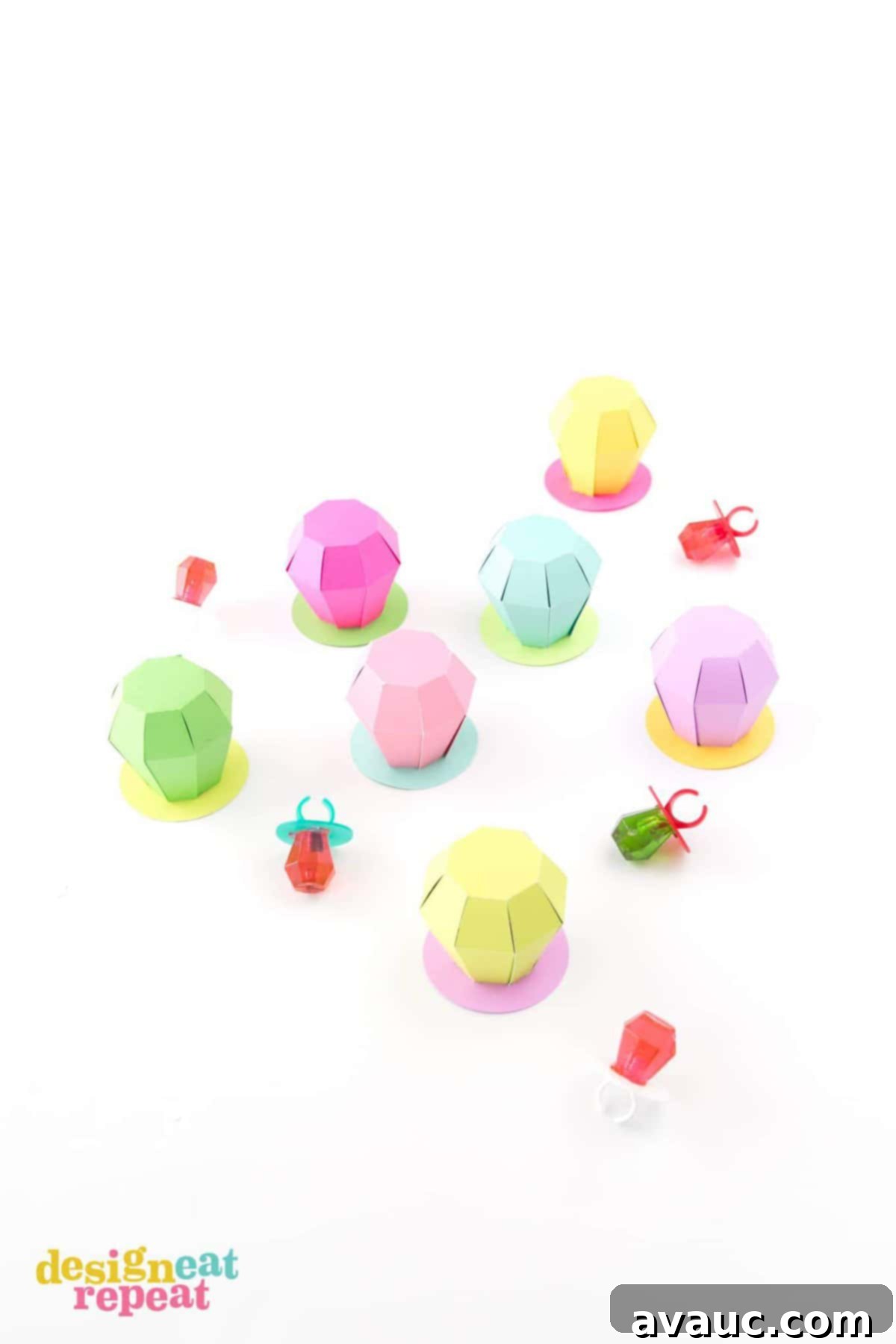Craft Your Own Ring Pop Treat Boxes 6 A collection of colorful paper Ring Pop treat boxes, perfect for any celebration.