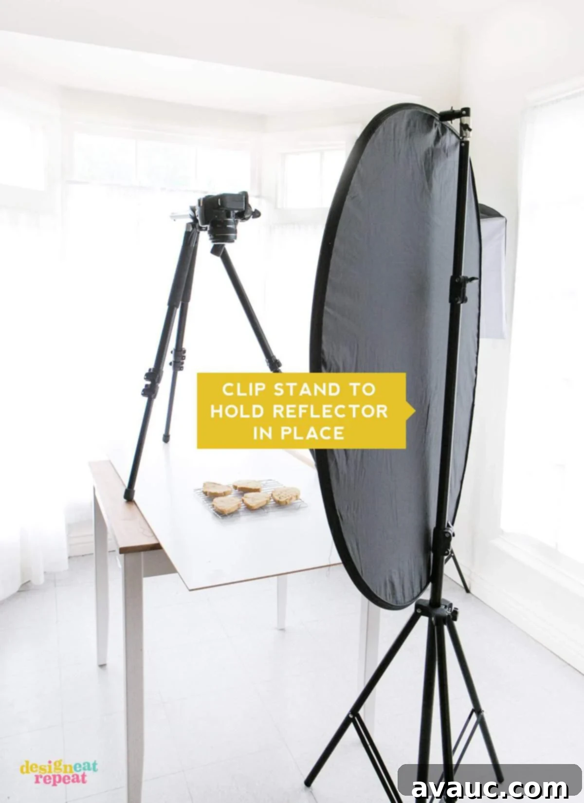 Adjustable clip stand holding a disc light reflector, enhancing light control for at-home food photography setups.