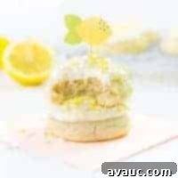 Luscious Lemon Cloud Cookies 7 A perfectly frosted soft and thick lemon sugar cookie with sprinkles.