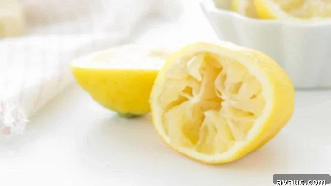 Freshly Squeezed Lemonade For One 5 A jug of lemonade with ice and lemon slices.