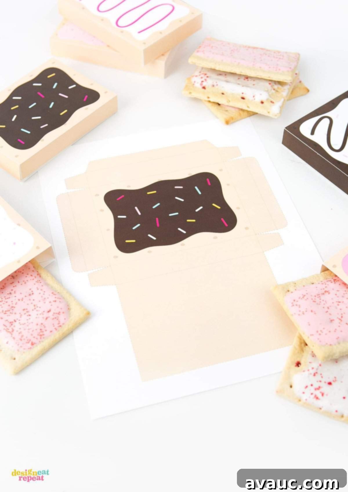 Hands carefully folding a printable toaster pastry box during the assembly process