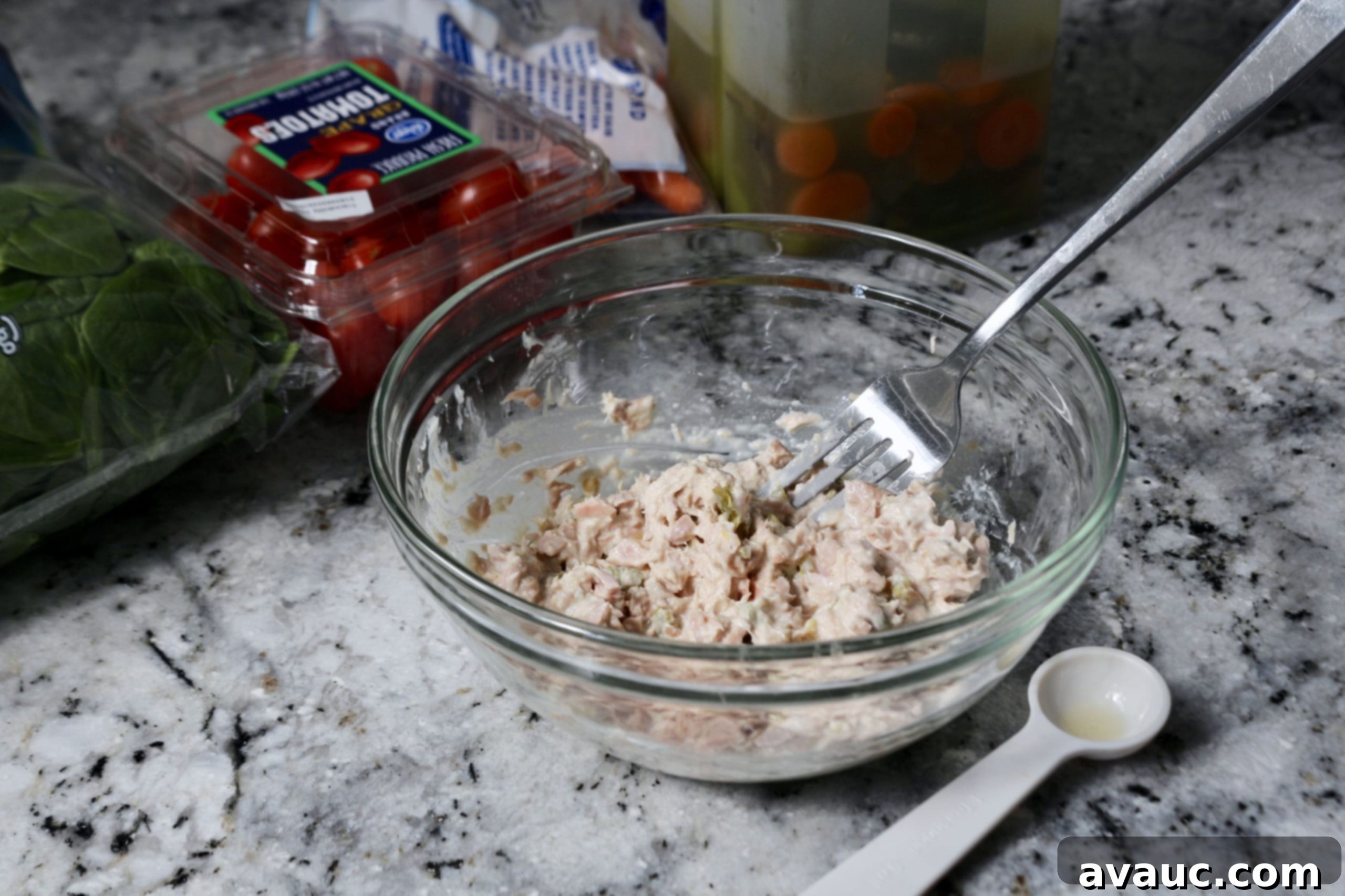 Mixing tuna for easy Whole30 tuna salad lunch bowl, Whole30 compliant ingredients