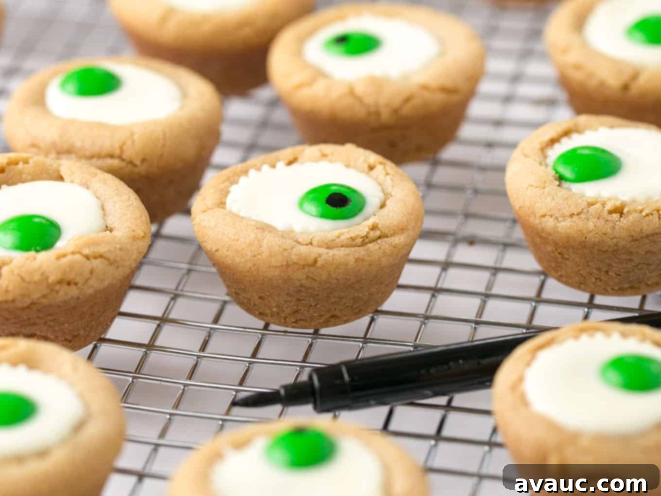 Spooktacular Peanut Butter Cup Eyeballs 13 Mini white peanut butter cup cookies with green M&M in center to look like Halloween eyeball.