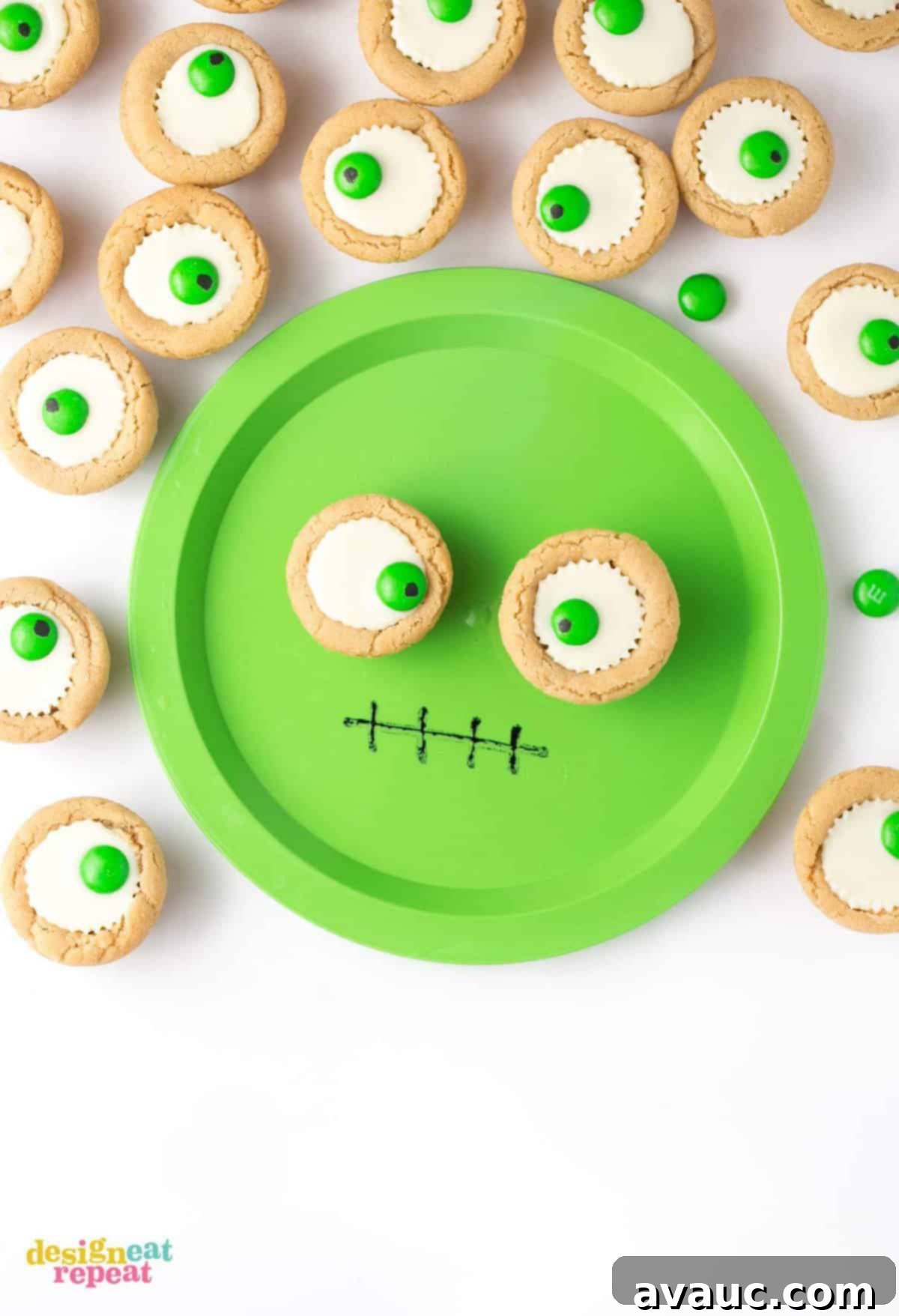Spooktacular Peanut Butter Cup Eyeballs 3 Mini white peanut butter cup cookies on green monster face plate.