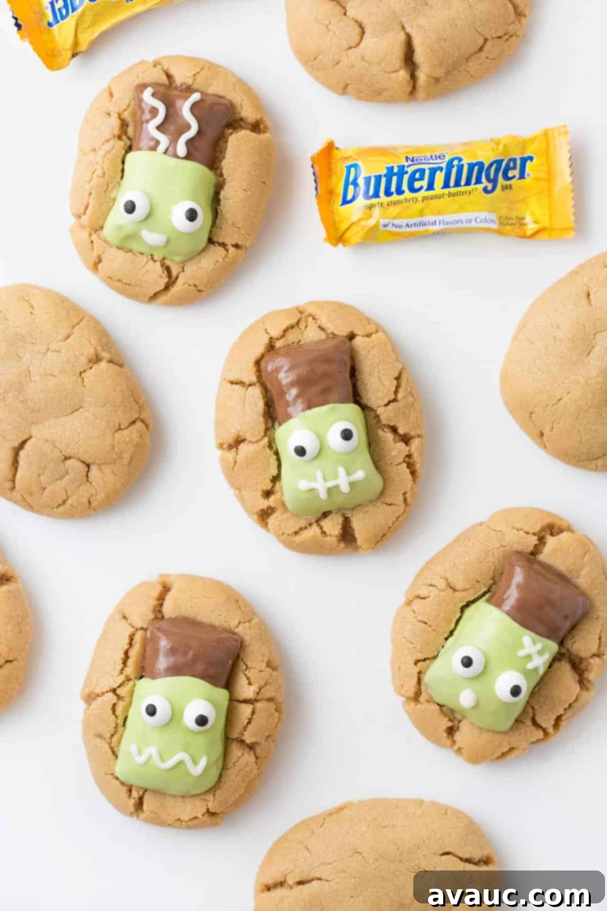 Peanut butter cookies topped with Butterfinger fun size candy bars that have been decorated to look like Frankenstein.
