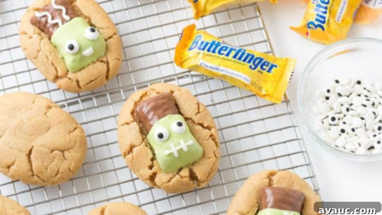 Peanut butter cookies topped with Butterfinger fun size candy bars that have been decorated to look like Frankenstein.