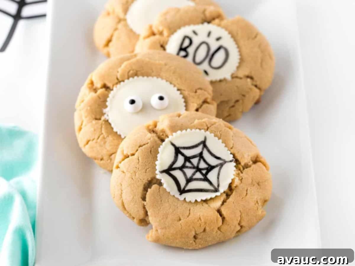 Design Your Own Simple Spooky Cookies 11 A platter of various easy Halloween cookies, showcasing different edible pen designs.