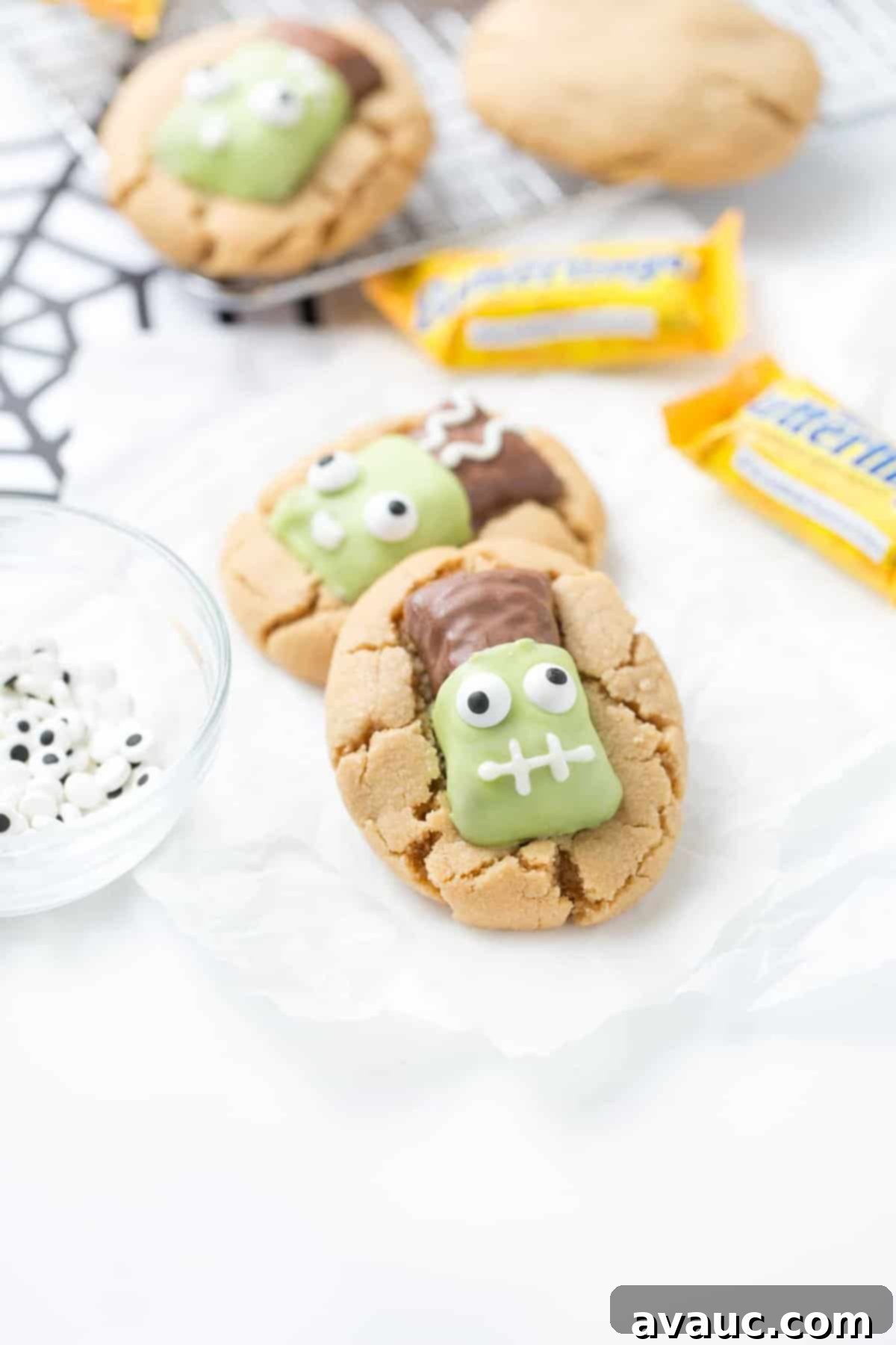 Peanut Butter Cookies topped with Frankenstein Butterfingers Candy Eyeballs - Easy Halloween Cookie Idea