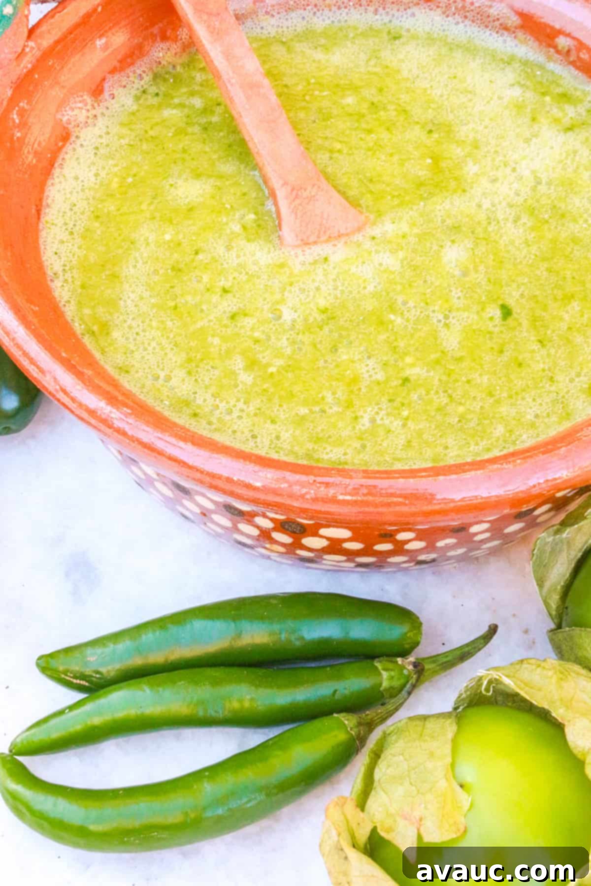 Side view of salsa verde taquera in a Mexican clay bowl