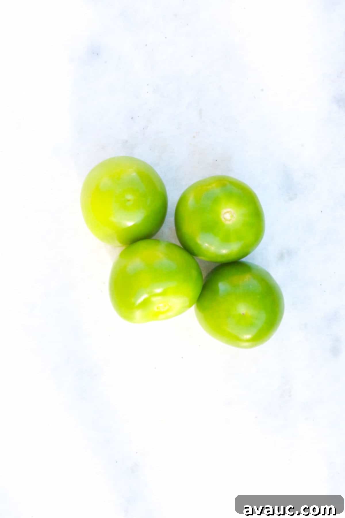 Tomatillos on white background