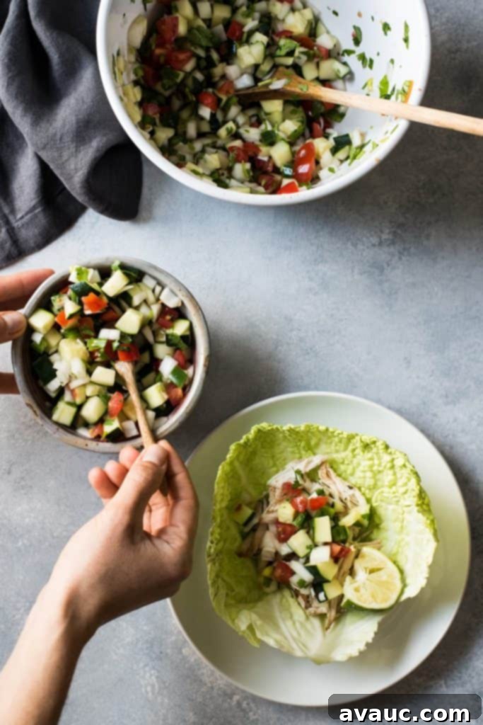 Refreshing Fresh Cucumber Salsa in a glass bowl, showcasing diced cucumbers, tomatoes, and herbs.