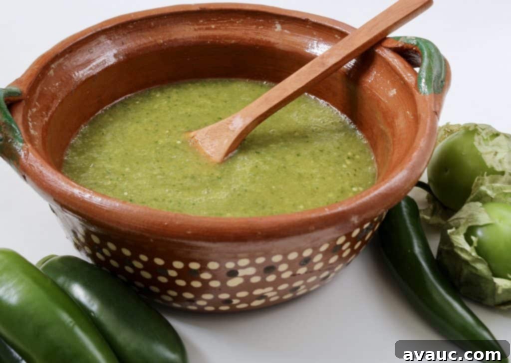 Smooth and vibrant Tomatillo Salsa Verde in a bowl, garnished with fresh cilantro.