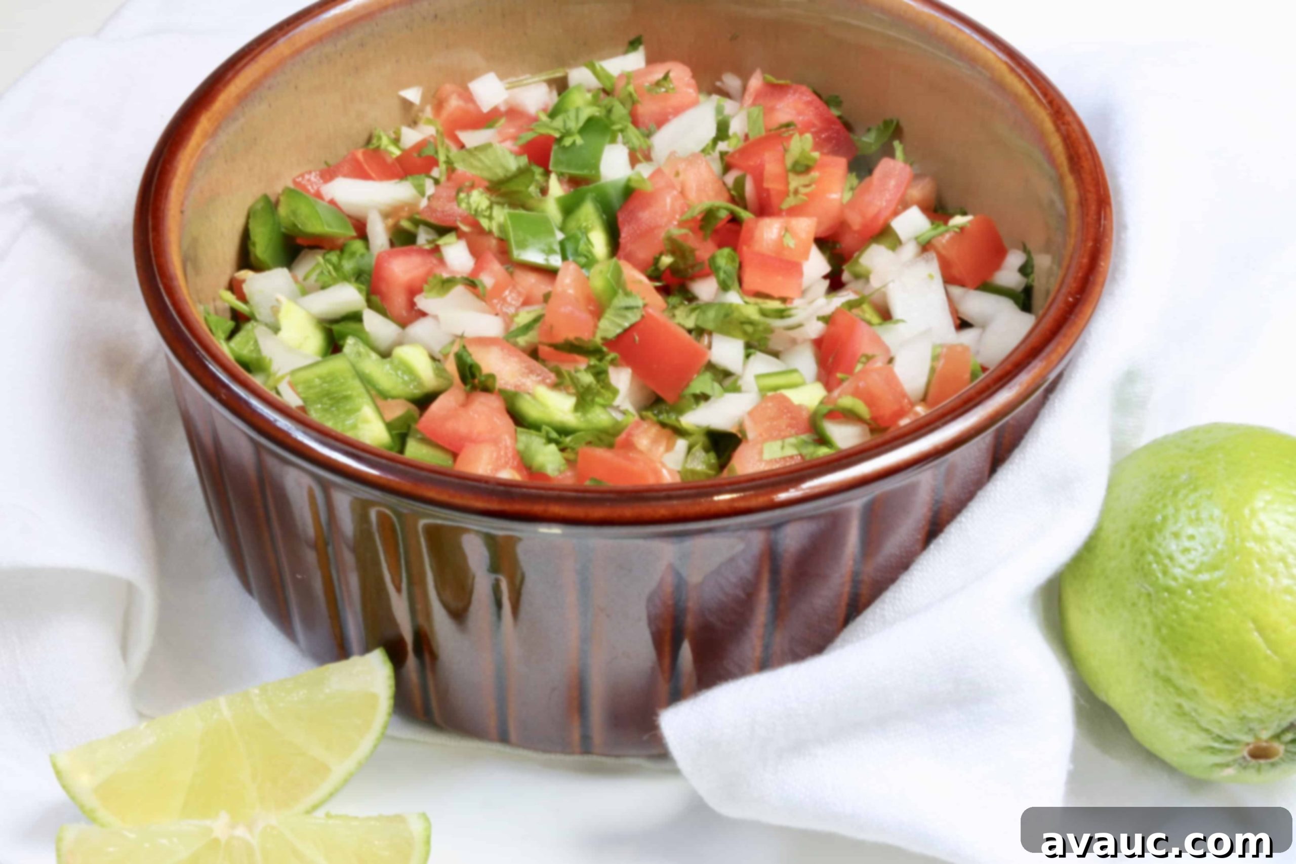 Close-up of fresh, vibrant Pico de Gallo salsa with diced tomatoes, onions, cilantro, and jalapeños.