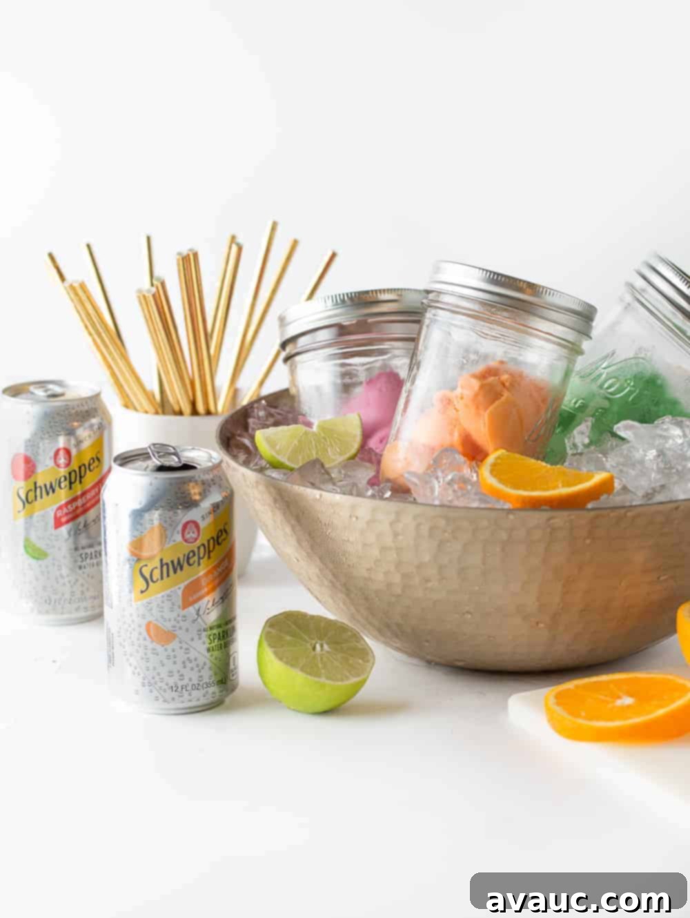 Mason jars filled with sherbet, kept cool in a bowl of ice, forming an inviting Sherbet Punch Bar display.