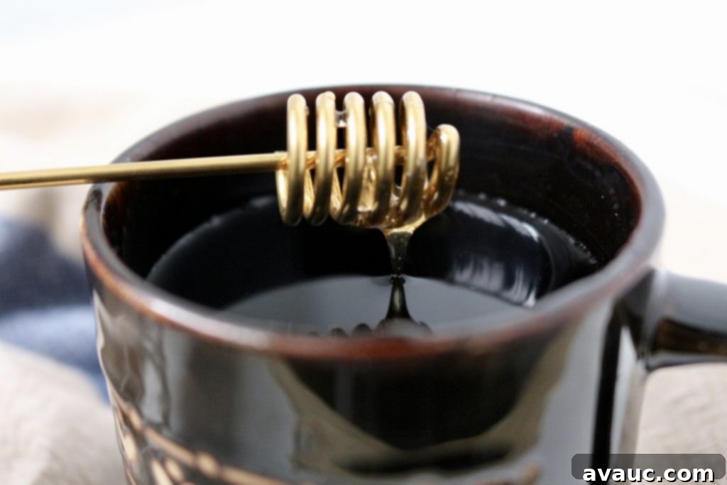Honey and water for natural cough relief and soothing a sore throat