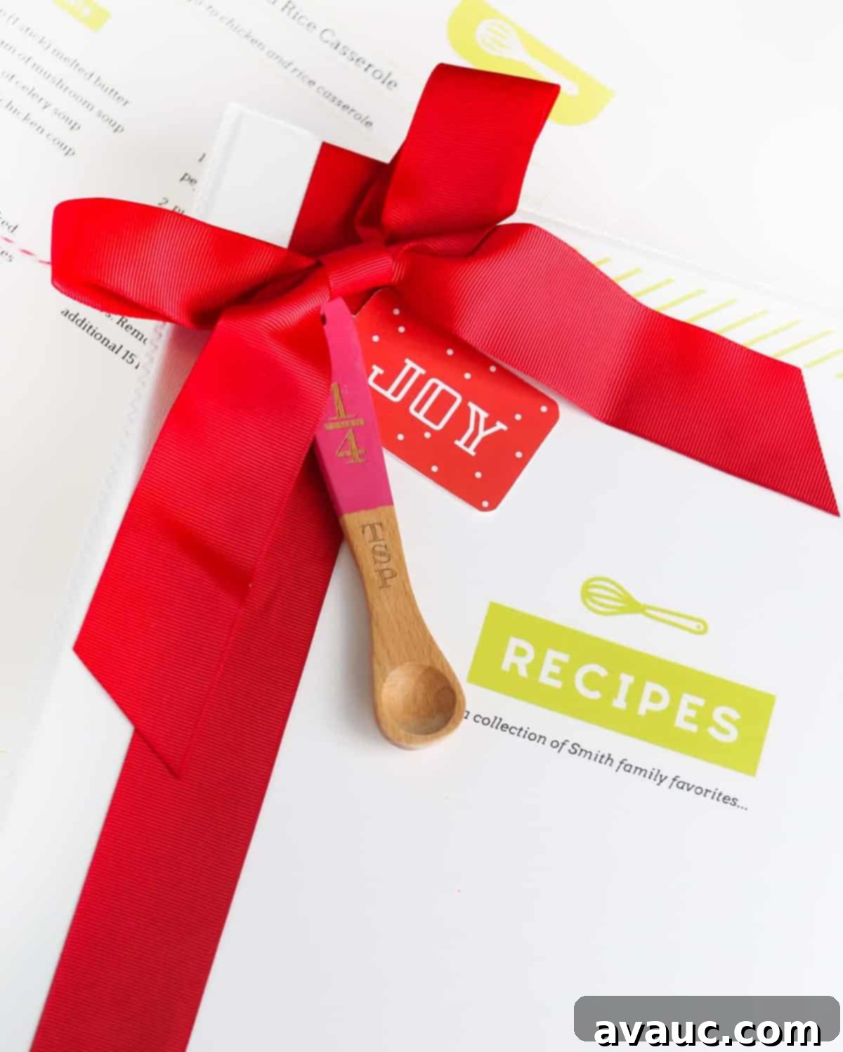 A beautifully completed DIY recipe binder tied with a bow, ready for gifting.