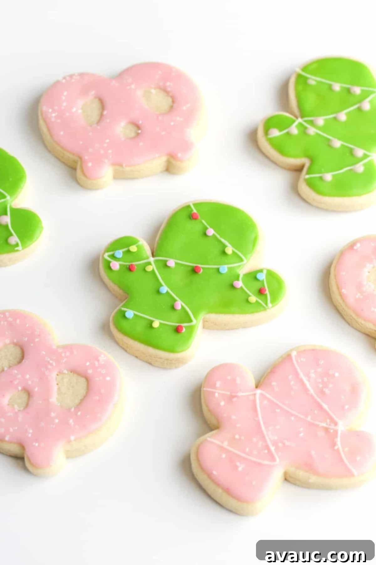 Christmas cactus green sugar cookies, pink cactus sugar cookies, and pink pretzel sugar cookies.