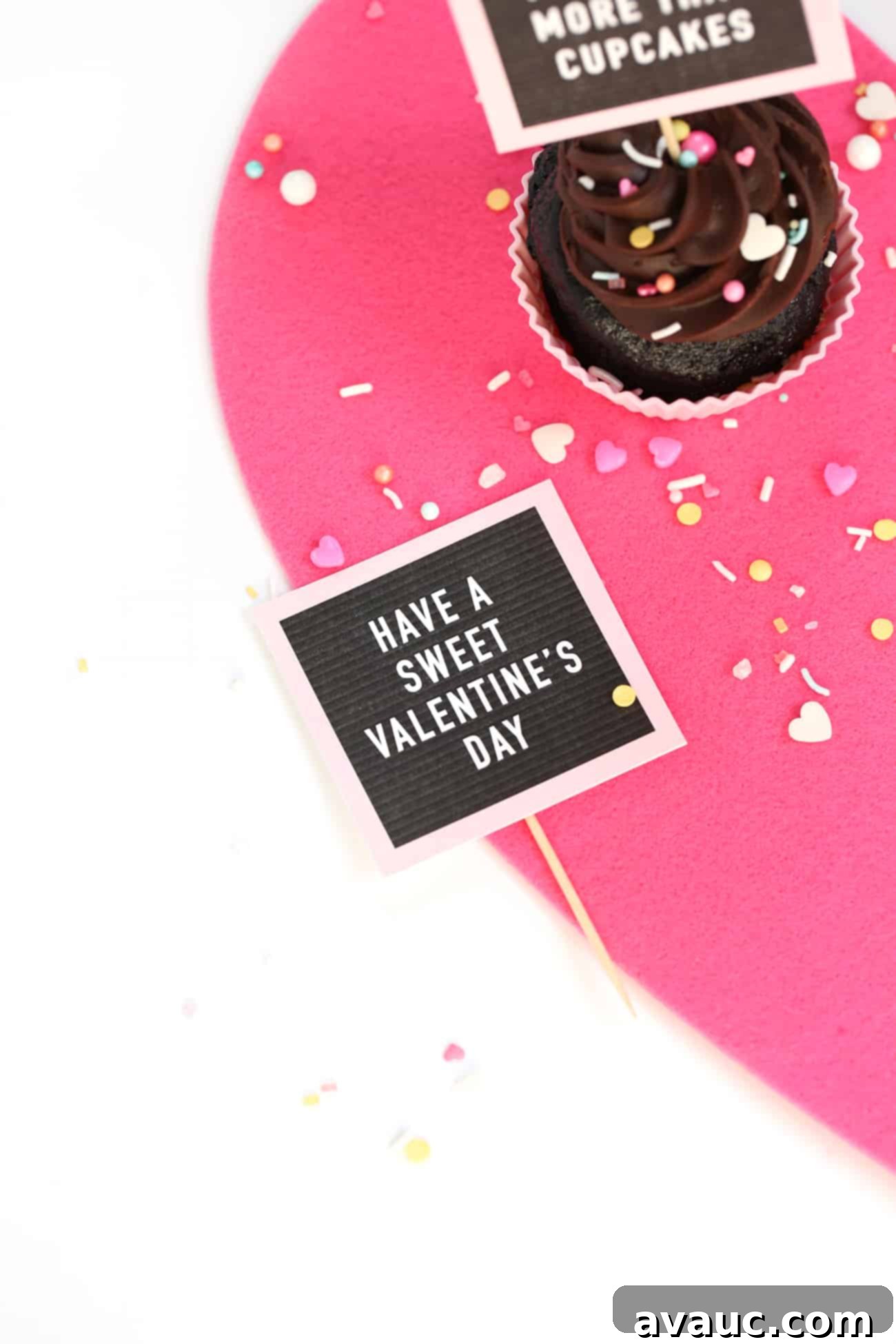 Chocolate cupcakes with Free Printable Valentine Cupcake Toppers - mini pink letterboards! Have a Sweet Valentine's Day and I Love You More Than Cupcakes Phrases