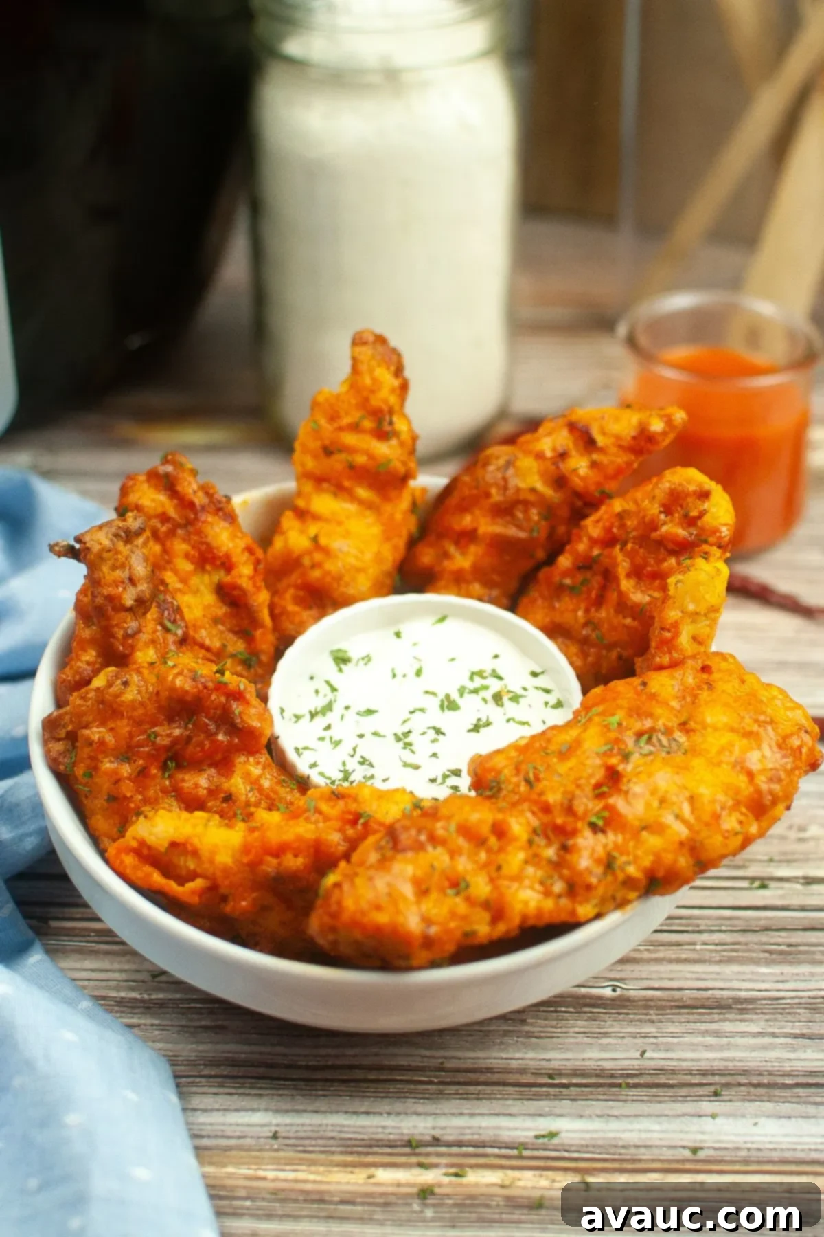A plate of perfectly cooked Air Fryer Chicken Tenders, showcasing their golden, crispy coating.