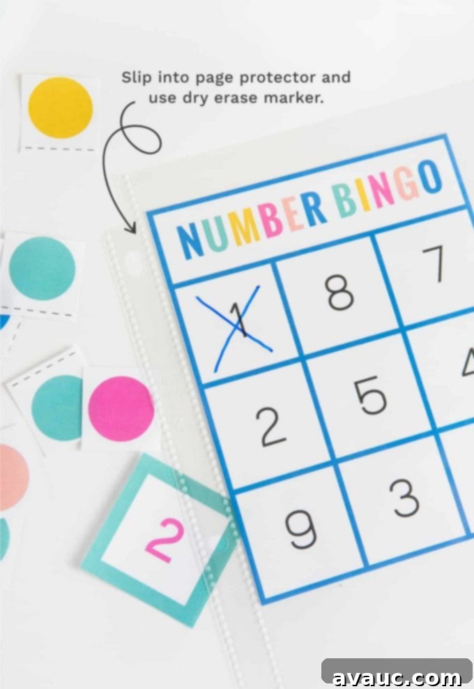 A child's hand placing a marker on a number bingo card