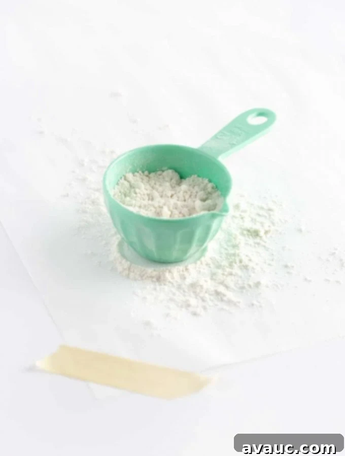 Mastering Flawless Cut Out Sugar Cookies 23 Parchment paper securely taped to the counter, prepared for rolling cookie dough