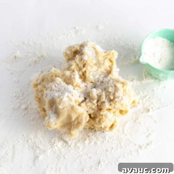 Mastering Flawless Cut Out Sugar Cookies 8 Sugar cookie dough being mixed in a bowl and formed into a rough ball