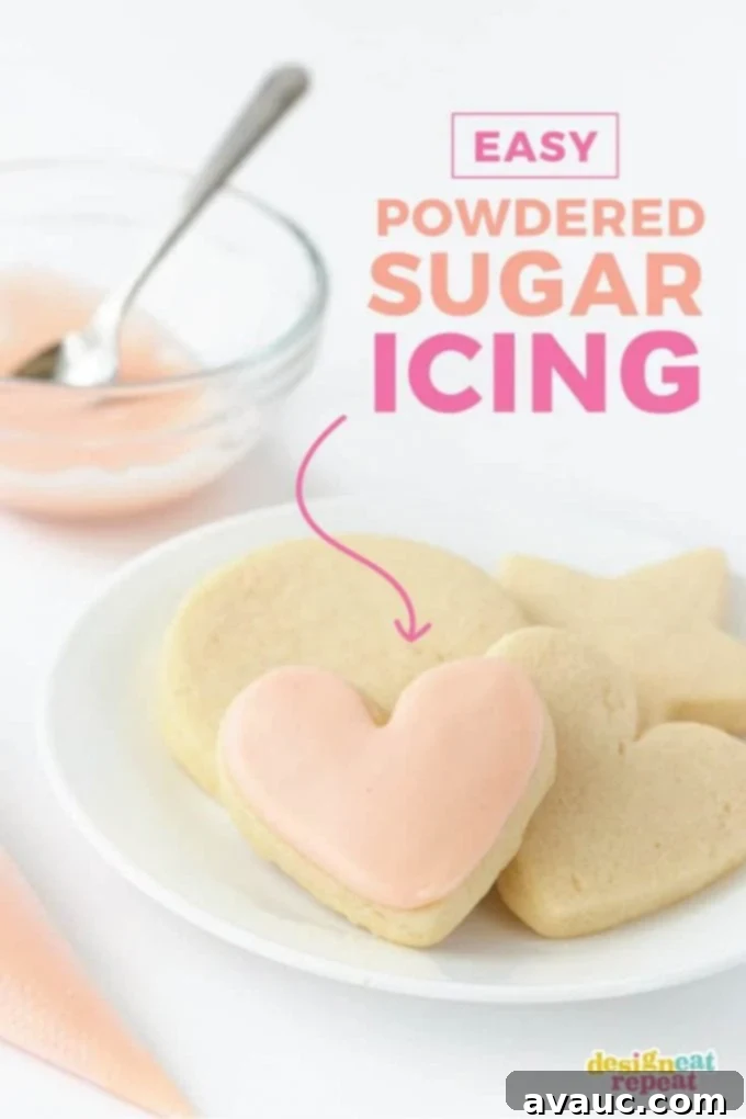 A plate of perfectly decorated heart-shaped sugar cookies with smooth powdered sugar icing, ready to be enjoyed.