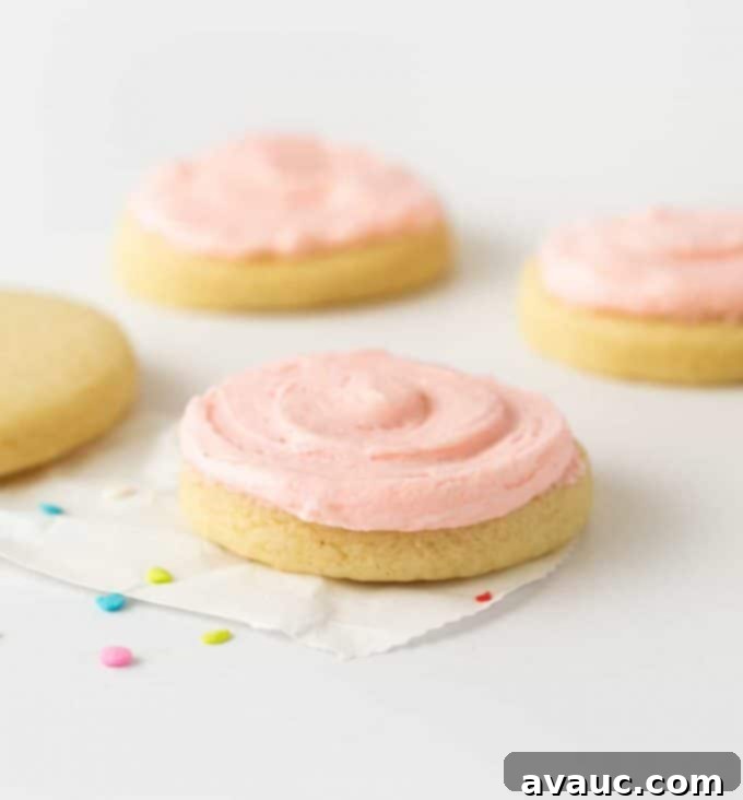 Simple frosted sugar cookie with pink buttercream