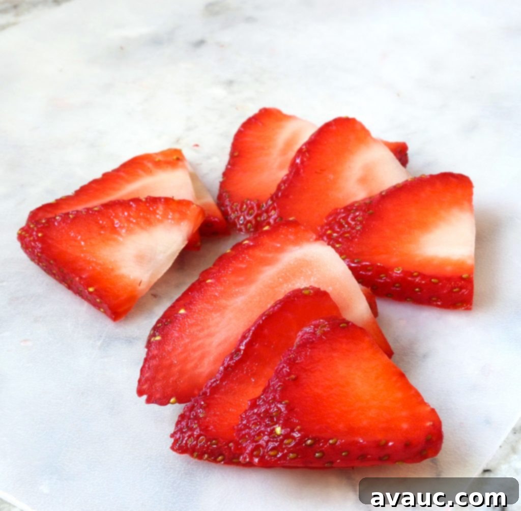 Thinly sliced strawberries #strawberrypaletas