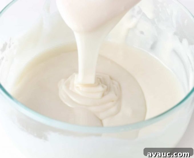 White icing being drizzled