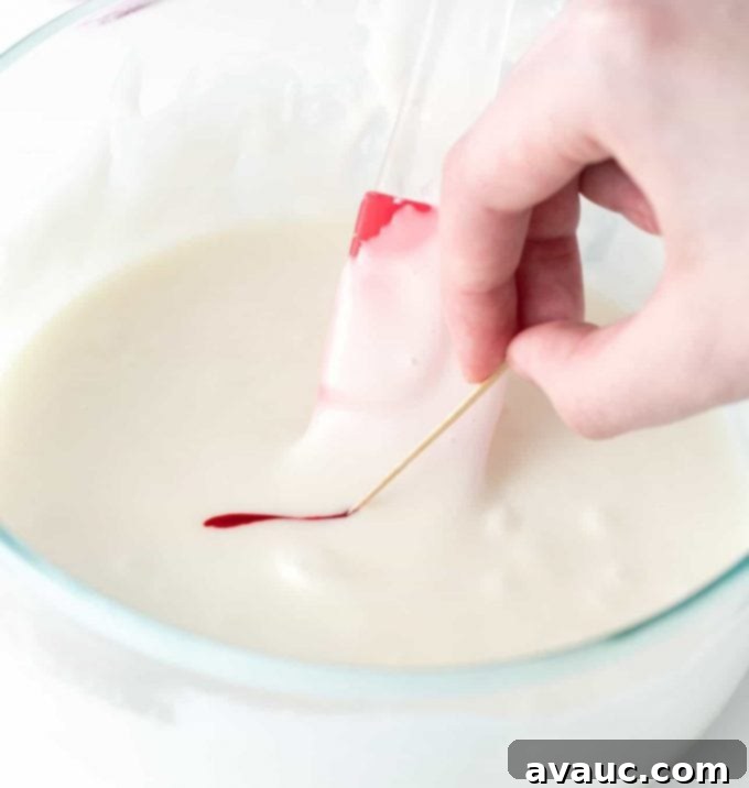 Coloring white icing with red food coloring using a toothpick