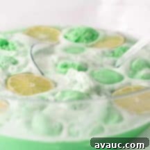Lime Sherbet Punch with lime slices and basil.