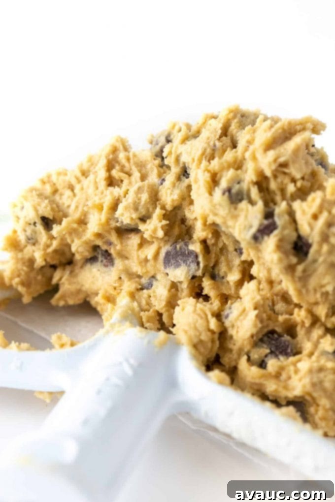Beater with sticky chewy chocolate chip cookie dough